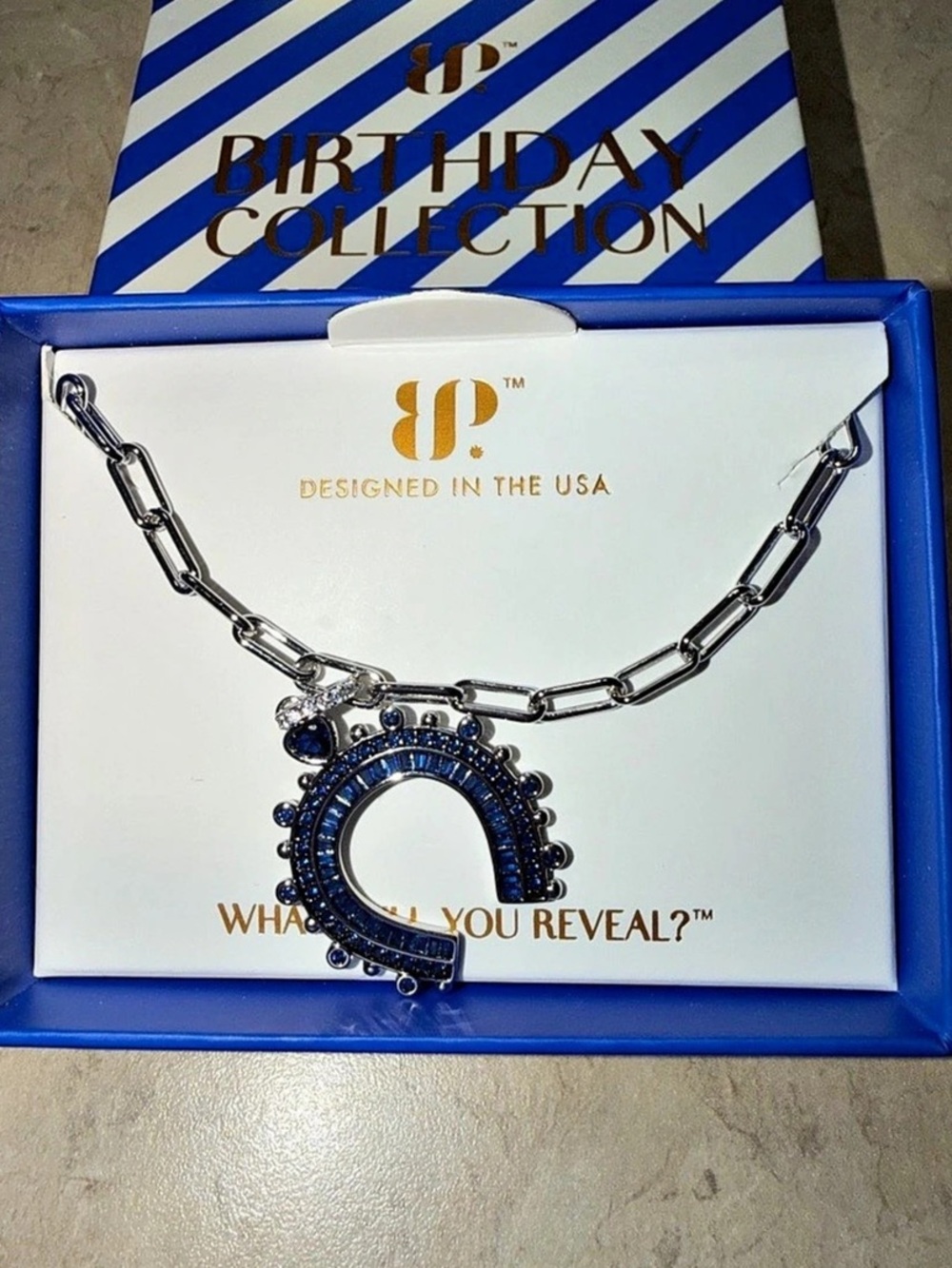 BP September Necklace-Lucky In Luxe Horseshoe Sapphire on Rhodium and Hematite